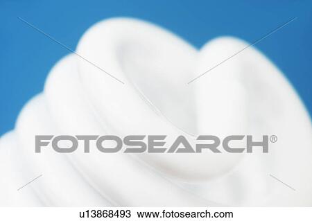Studio shot of energy efficient lightbulb on blue background View Large Photo Image Stock Image - Studio shot of energy efficient lightbulb on blue background. Fotosearch