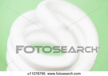 Studio shot of energy efficient lightbulb on green background View Large Photo Image Stock Photography - Studio shot of energy efficient lightbulb on green background. Fotosearch
