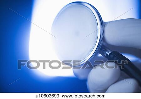 Studio shot of hand holding stethoscope View Large Photo Image Stock Photo - Studio shot of hand holding stethoscope. Fotosearch