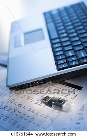 Studio shot of laptop with memory stick View Large Photo Image Picture - Studio shot of laptop with memory stick. Fotosearch