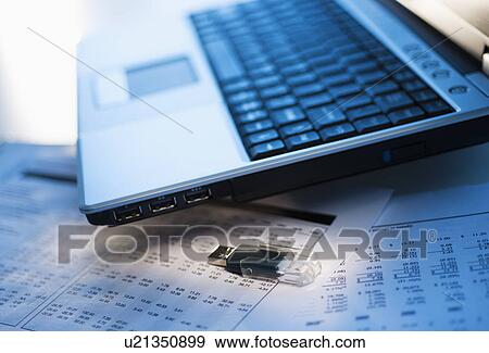 Studio shot of laptop with memory stick View Large Photo Image Stock Photo - Studio shot of laptop with memory stick. Fotosearch