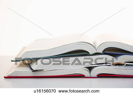 Stock Image - Studio shot of open books. Fotosearch