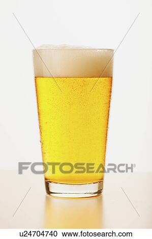 Studio shot of pale ale in glass View Large Photo Image Stock Image - Studio shot of pale ale in glass. Fotosearch