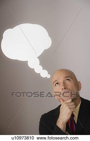 Studio shot of pensive business man with speech bubble above head View Large Photo Image Stock Image - Studio shot of pensive business man with speech bubble above head. Fotosearch