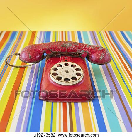 Studio shot of rotary phone on striped background View Large Photo Image Stock Image - Studio shot of rotary phone on striped background. Fotosearch