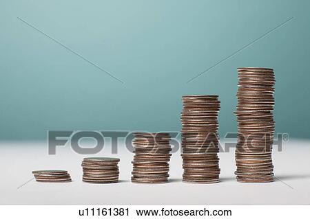 Stock Image - Studio shot of stacks of coins. Fotosearch