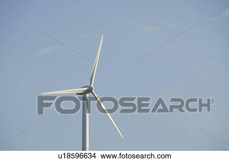 Picture - Turkey, Izmir, wind turbine against blue sky. Fotosearch