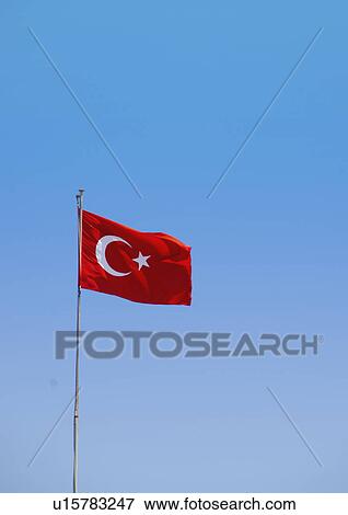 Stock Photo - Turkey, Turkish flag against blue sky. Fotosearch