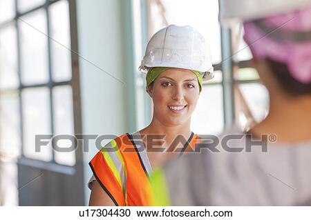 Stock Image - Two female manual workers. Fotosearch