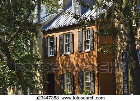 Stock Photo - USA, Georgia, Savannah, Hose among trees. Fotosearch