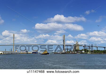Stock Photo - USA, Georgia, Savannah, Tamadge Bridge over Savannah River. Fotosearch