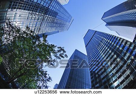 Stock Photograph - USA, New York City, Low angle view of skyscrapers. Fotosearch