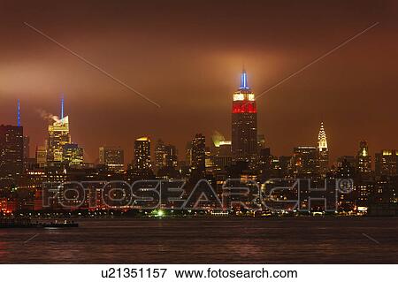 Stock Photo - USA, New York City, Manhattan skyline at night. Fotosearch