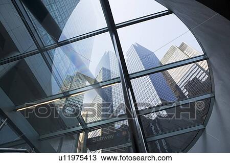 Stock Image - USA, New York State, New York City, Manhattan, Low angle view of skyscrapers. Fotosearch