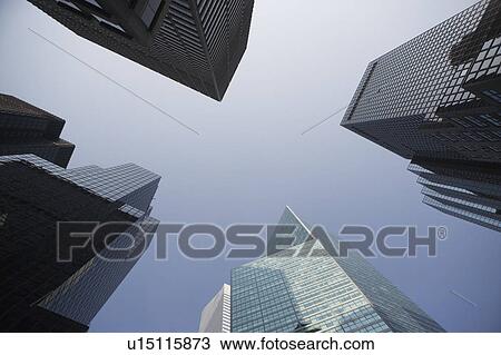 Stock Image - USA, New York State, New York City, Manhattan, Low angle view of skyscrapers. Fotosearch