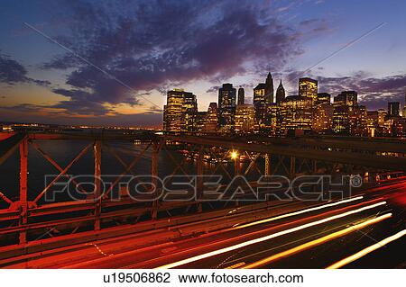 USA, New York State, New York City, Lower Manhattan and Brooklyn Bridge at dusk View Large Photo Image Stock Image - USA, New York State, New York City, Lower Manhattan and Brooklyn Bridge at dusk. Fotosearch