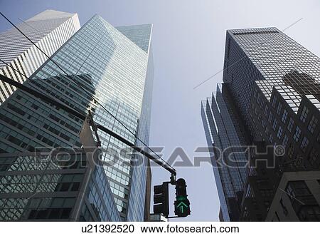 Stock Image - USA, New York State, New York City, Manhattan, Low angle view of skyscrapers. Fotosearch
