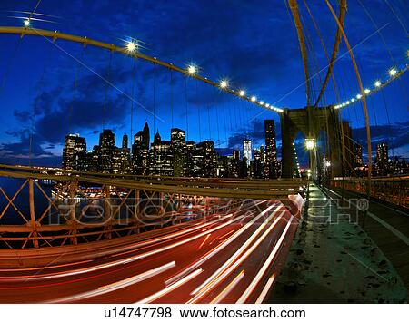 Stock Photo - USA, New York State, New York City, Manhattan, Brooklyn Bridge at dusk. Fotosearch