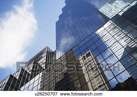 Stock Photo - USA, New York State, New York City, Manhattan, Low angle view of skyscrapers. Fotosearch