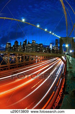 Stock Photo - USA, New York State, New York City, Manhattan, Brooklyn Bridge at dusk. Fotosearch