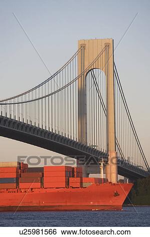 Stock Photograph - USA, New York State, New York City, Brooklyn, Container Ship under Verrazano-Narrows Bridge. Fotosearch