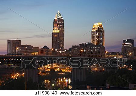 Stock Image - USA, Ohio, Cleveland, Skyline at sunset. Fotosearch