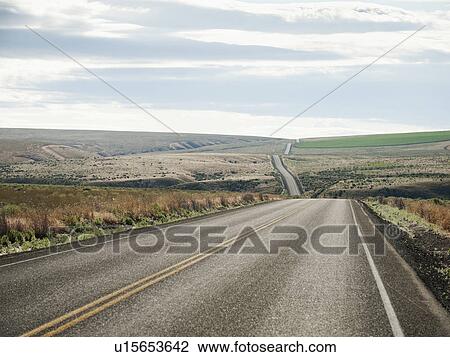 USA, Oregon, Boardman, Rolling landscape with empty road View Large Photo Image Stock Image - USA, Oregon, Boardman, Rolling landscape with empty road. Fotosearch