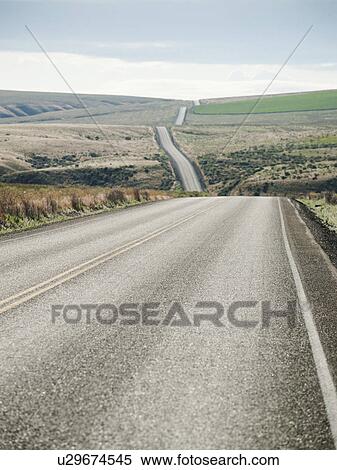 USA, Oregon, Boardman, Rolling landscape with empty road View Large Photo Image Stock Photography - USA, Oregon, Boardman, Rolling landscape with empty road. Fotosearch