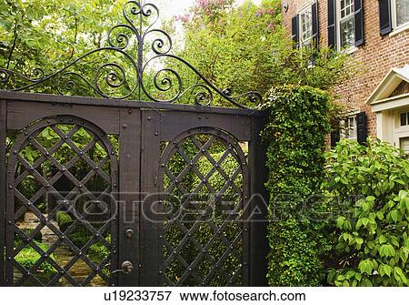 USA, South Carolina, Charleston, Close up of ornate iron gate View Large Photo Image Stock Photo - USA, South Carolina, Charleston, Close up of ornate iron gate. Fotosearch