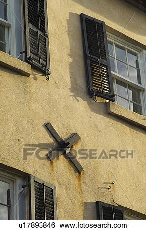 Stock Photograph - USA, South Carolina, Charleston, Close up of hurricane clamp of building wall. Fotosearch
