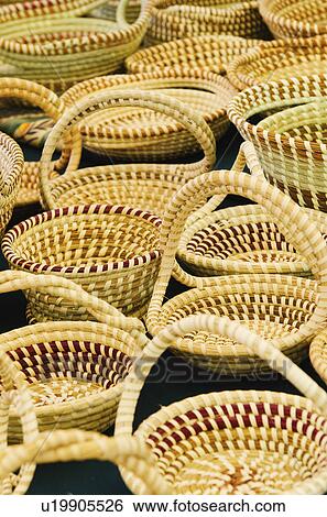 Stock Photograph - USA, South Carolina, Charleston, Close up of sweetgrass baskets on street market. Fotosearch