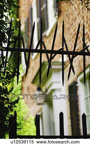 USA, South Carolina, Charleston, Close up of iron spikes on fence View Large Photo Image Stock Photography - USA, South Carolina, Charleston, Close up of iron spikes on fence. Fotosearch