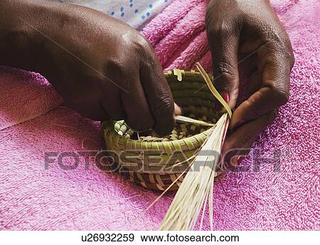 USA, South Carolina, Charleston, Hands of worker weaving sweetgrass View Large Photo Image Stock Photo - USA, South Carolina, Charleston, Hands of worker weaving sweetgrass. Fotosearch