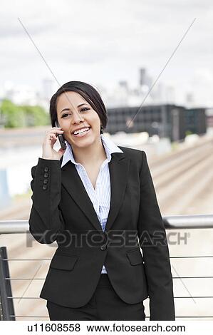 USA, Washington, Seattle, Young businesswoman talking on phone View Large Photo Image Stock Photo - USA, Washington, Seattle, Young businesswoman talking on phone. Fotosearch