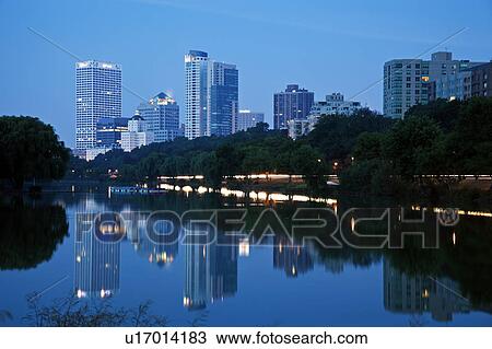 Stock Image - USA, Wisconsin, Milwaukee, Downtown district at dusk. Fotosearch