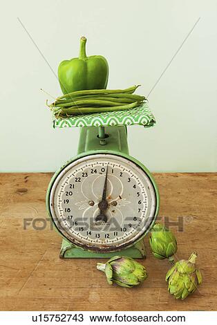 Vegetables on old-fashioned kitchen scale, studio shot View Large Photo Image Stock Image - Vegetables on old-fashioned kitchen scale, studio shot. Fotosearch