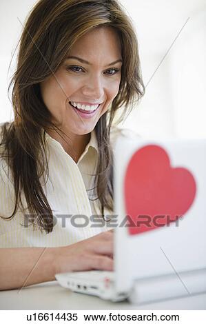 Stock Photography - Woman dating online. Fotosearch