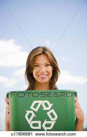 Woman holding recycling bin View Large Photo Image Stock Image - Woman holding recycling bin. Fotosearch