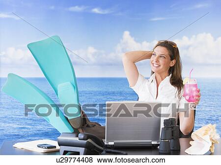 Woman in flippers daydreaming at desk View Large Photo Image Stock Photo - Woman in flippers daydreaming at desk. Fotosearch