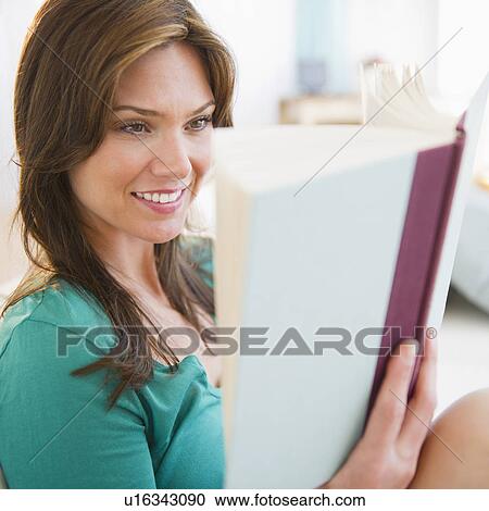 Stock Image - Woman reading book. Fotosearch