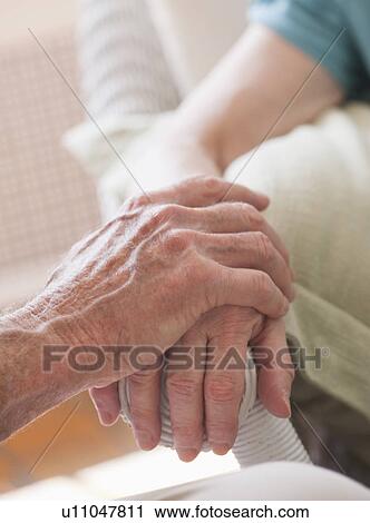 Stock Image - Wrinkled hands of Senior people. Fotosearch