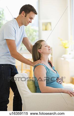 Young man massaging pregnant partner View Large Photo Image Stock Photography - Young man massaging pregnant partner. Fotosearch