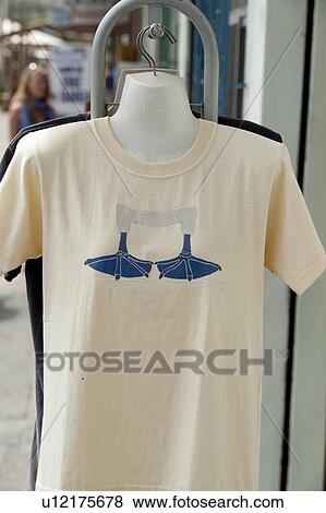 Stock Photo - Close-up of a souvenir t-shirt with Blue-Footed booby's legs printed on it, Puerto Baquerizo Moreno, San Cristobal Island, Galapagos Islands, Ecuador. Fotosearch