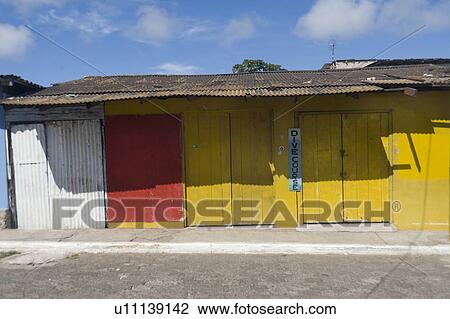 Stock Image - Closed stores, Puerto Baquerizo Moreno, San Cristobal Island, Galapagos Islands, Ecuador. Fotosearch