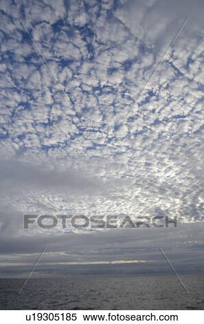 Clouds over the Pacific Ocean, San Cristobal Island, Galapagos Islands, Ecuador View Large Photo Image Stock Photography - Clouds over the Pacific Ocean, San Cristobal Island, Galapagos Islands, Ecuador. Fotosearch