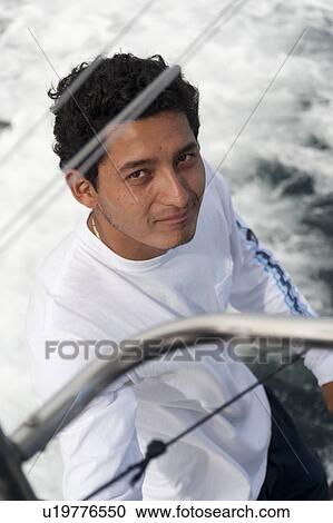High angle view of a man on a boat, San Cristobal Island, Galapagos Islands, Ecuador View Large Photo Image Stock Image - High angle view of a man on a boat, San Cristobal Island, Galapagos Islands, Ecuador. Fotosearch