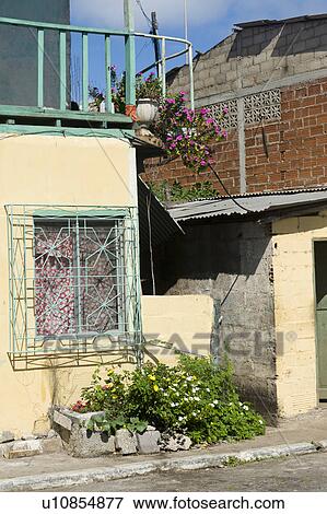 Stock Photo - Houses at the roadside, Puerto Baquerizo Moreno, San Cristobal Island, Galapagos Islands, Ecuador. Fotosearch