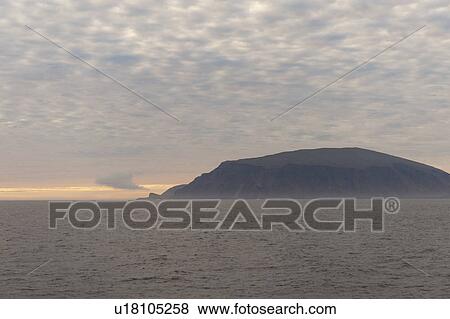 Stock Photo - Island in the Pacific Ocean at sunset, Isabela Island, Galapagos Islands, Ecuador. Fotosearch