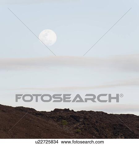 Moon in the sky, Bartolome island, Galapagos Islands, Ecuador View Large Photo Image Picture - Moon in the sky, Bartolome island, Galapagos Islands, Ecuador. Fotosearch