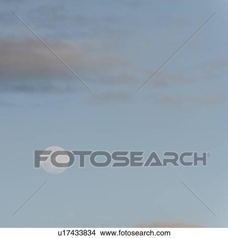 Moon in the sky, Santiago Island, Galapagos Islands, Ecuador View Large Photo Image Picture - Moon in the sky, Santiago Island, Galapagos Islands, Ecuador. Fotosearch